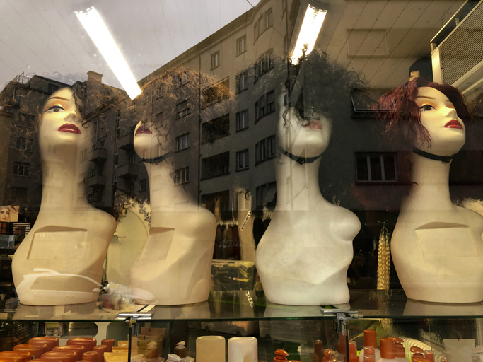 Wig mannequin in a store window
