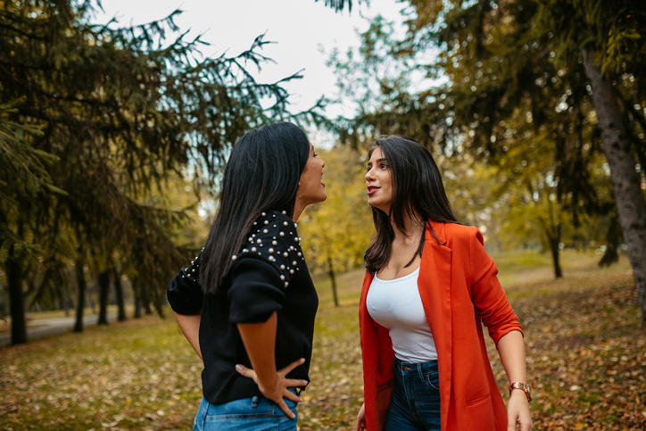 Two Female Friends Arguing In A Public Park