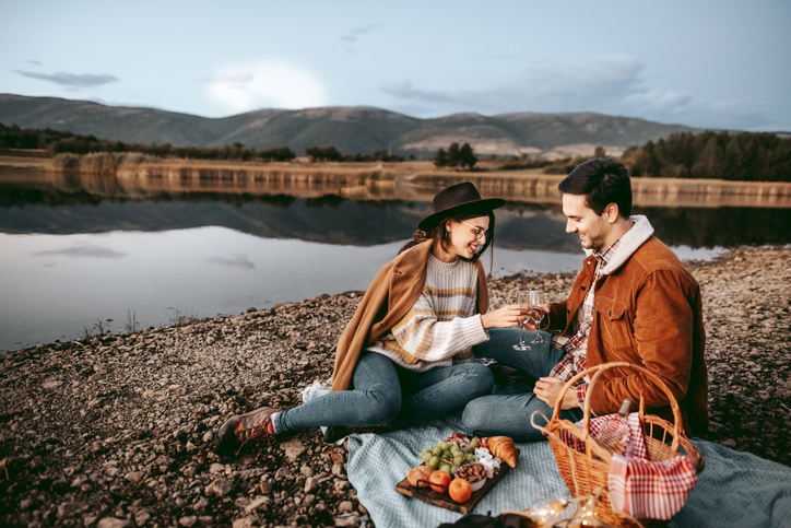 Young romantic couple on a picnic in the nature