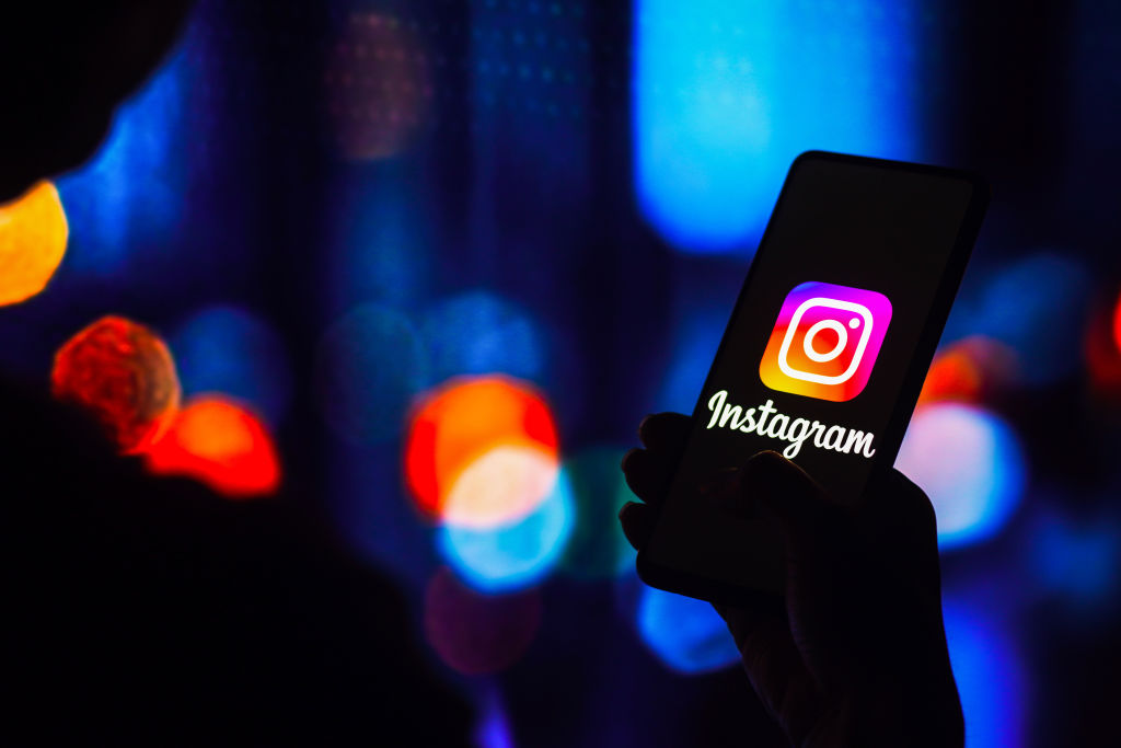 In this photo illustration, the Instagram logo is displayed...