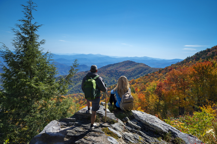 Couple hiking in the autumn mountains.