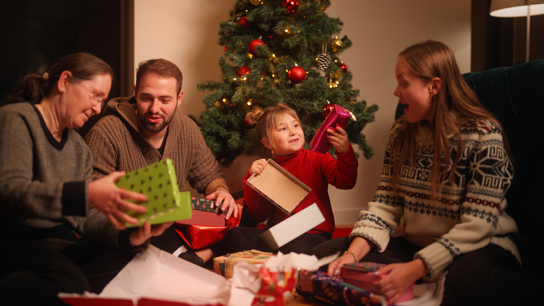 Two generation family exchanging Christmas presents