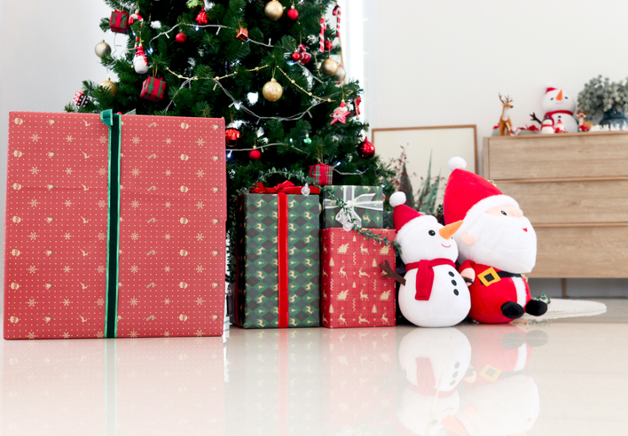 Beautiful Christmas gifts under Christmas tree at living room, Xmas and new year home decorations, festive tree decorated with decoration items, winter holiday traditional celebration