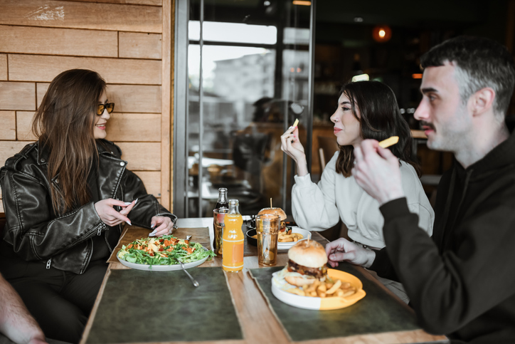 Friends Discussing Different Food Choices On