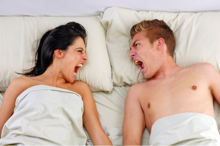Angry couple bed.