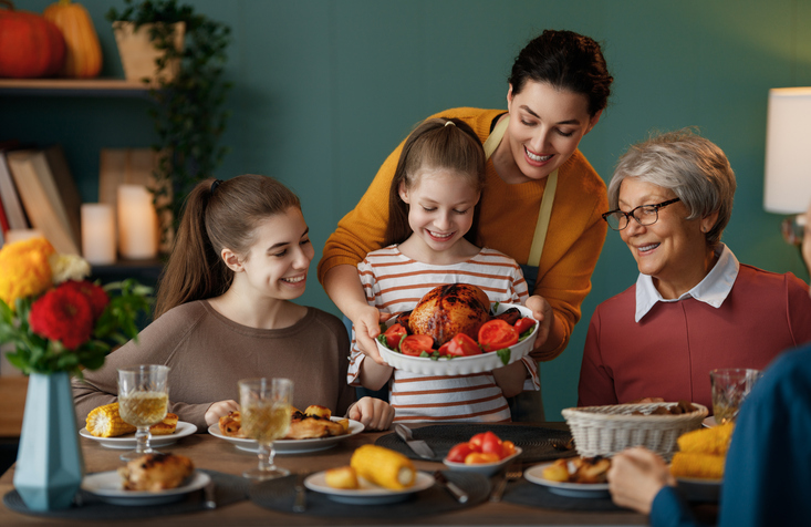 Family celebrating Thanksgiving Day