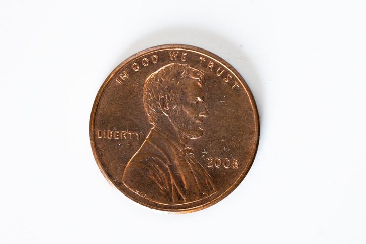 Close-up of a 2008 Lincoln penny obverse showing Lincoln profile, IN GOD WE TRUST, LIBERTY and the year for numismatic detail.