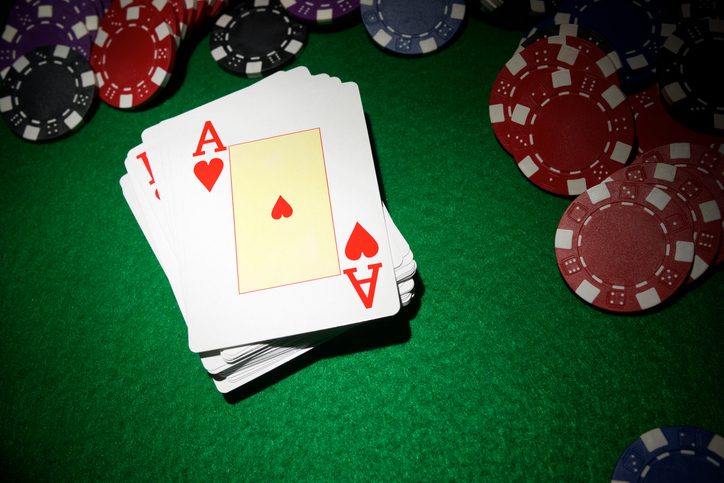 Deck of cards to play poker on a green mat