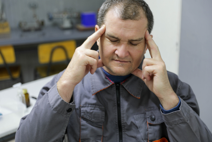Worker Suffering From Headache And Stress At Work